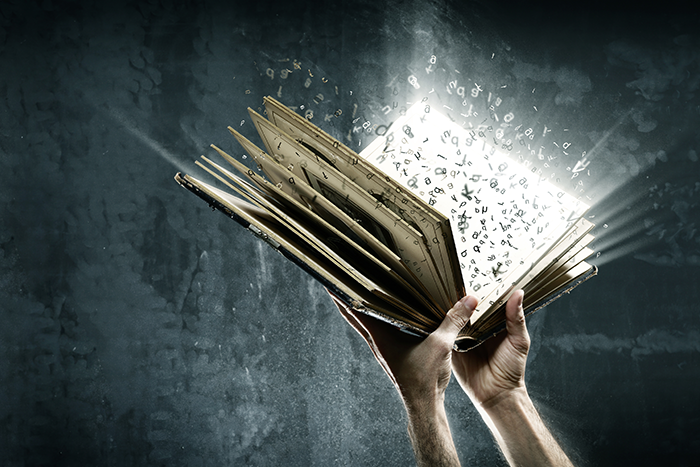 Photo of two hands holding a book